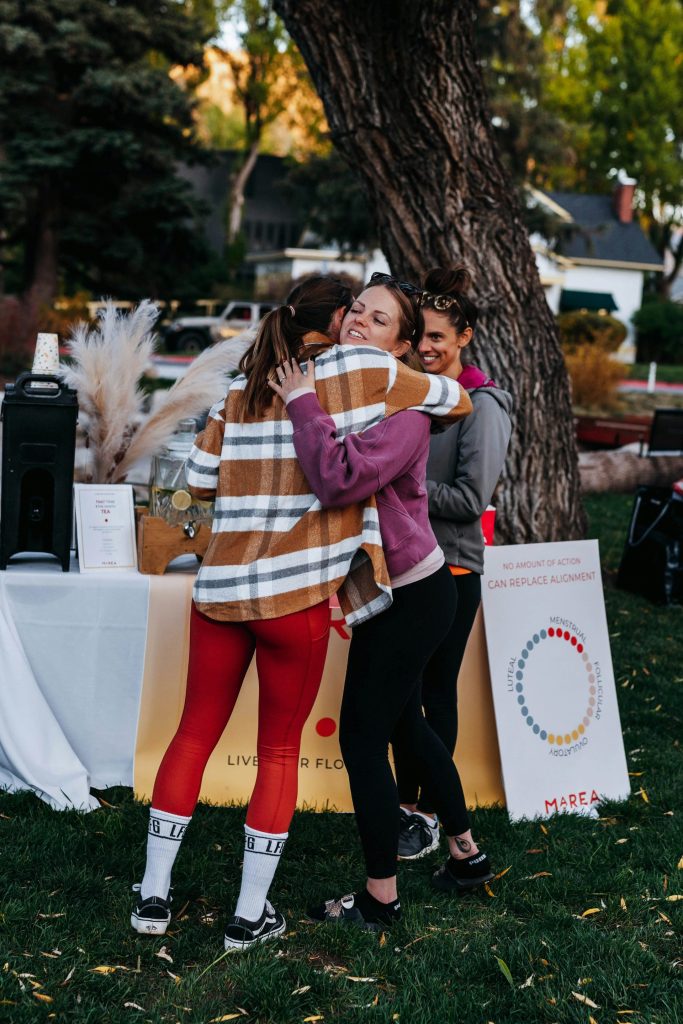 a couple of people that are hugging each other